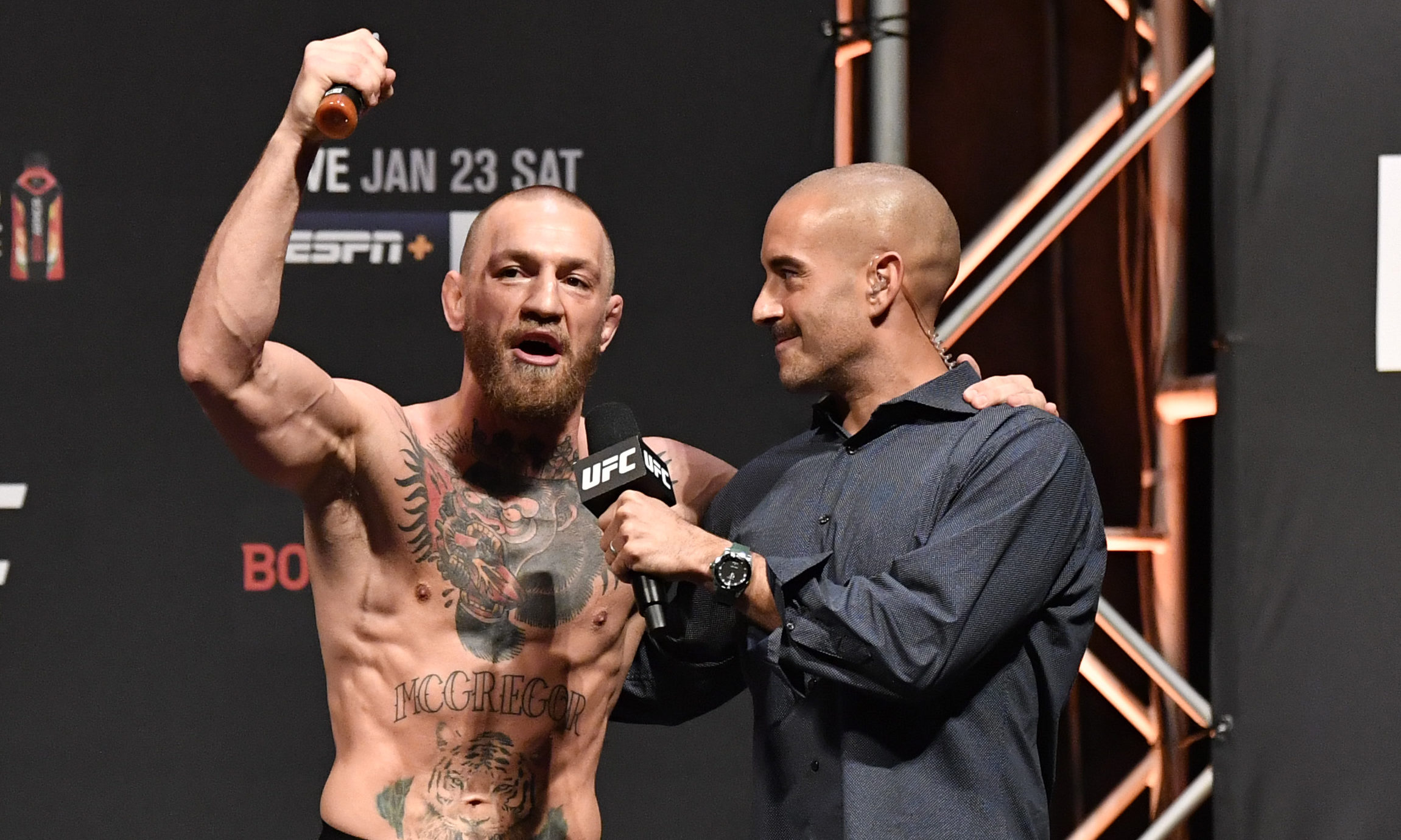 exclusive-jon-anik-modelo-ufc-team-up-for-gold-standard-fan-giveaway-boardroom