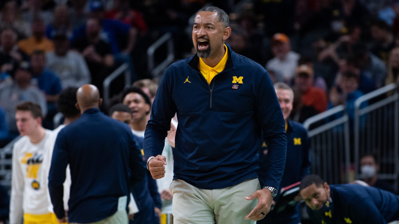 Michigan Wolverines basketball coach Juwan Howard shouting from the sideline during an NCAA Tournament game