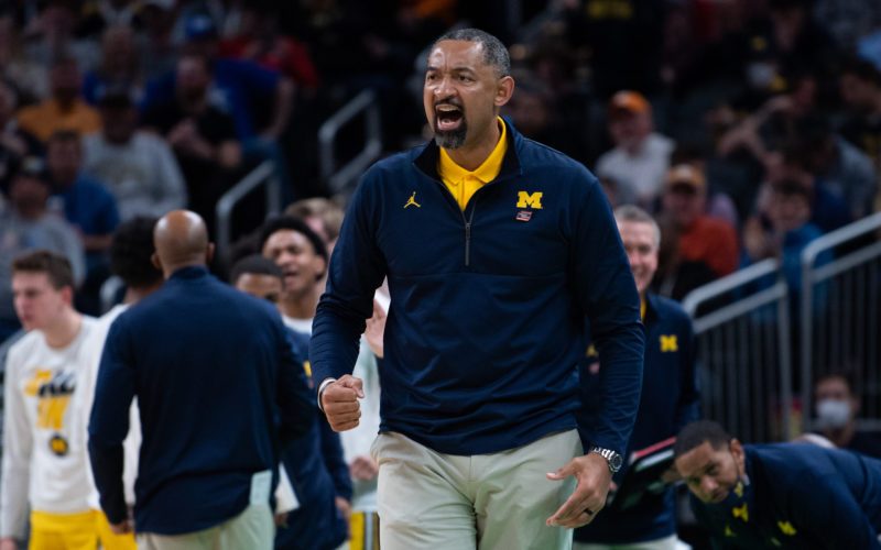 Michigan Wolverines basketball coach Juwan Howard shouting from the sideline during an NCAA Tournament game