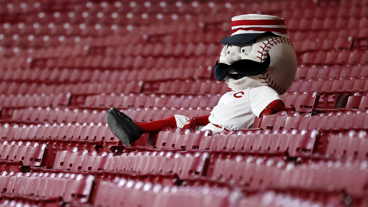 Cincinnat Reds mascot Mr. Red sitting in the stands watching a 2020 game at Great American Ballpark