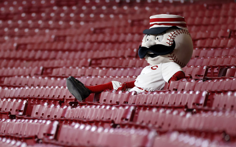 Cincinnat Reds mascot Mr. Red sitting in the stands watching a 2020 game at Great American Ballpark