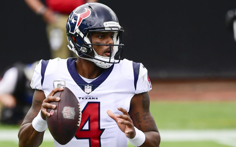 NFL quarterback Deshaun Watson looking down the field to throw the ball against the Jacksonville Jaguars at TIAA Bank Field