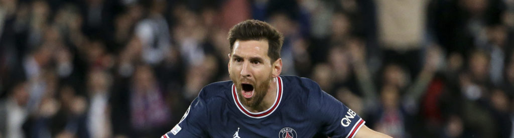 Soccer player Lionel Messi running with his arms spread celebrating a goal for Paris Saint-German