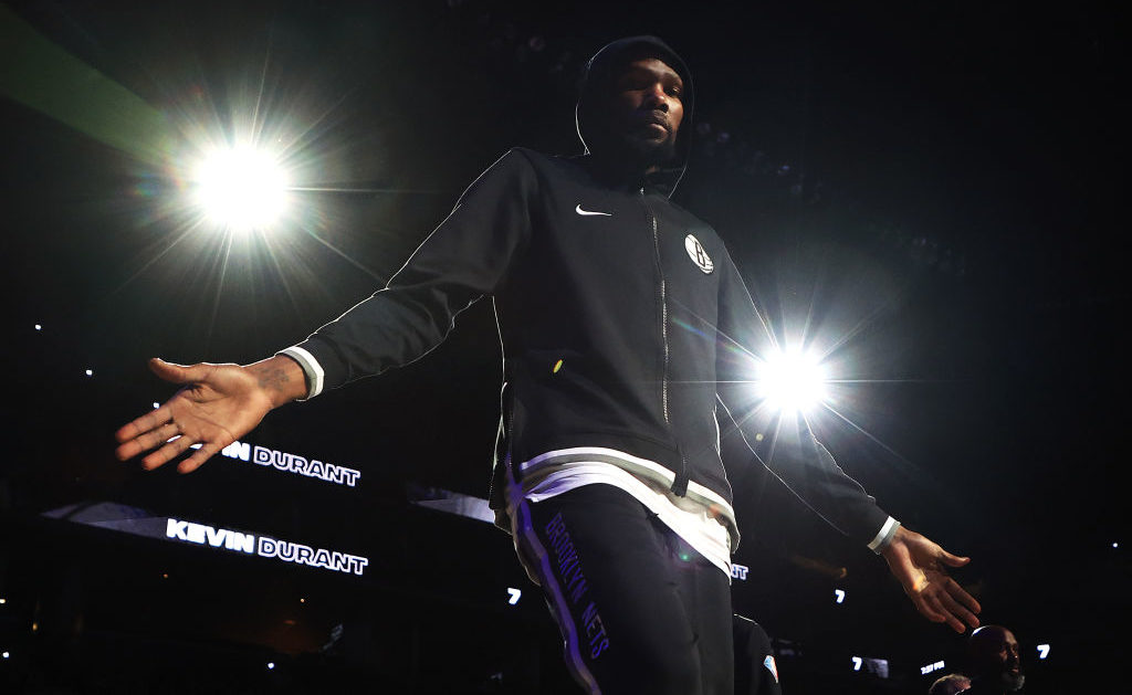 Basketball player Kevin Durant entering a game from the sideline for the Brooklyn Nets