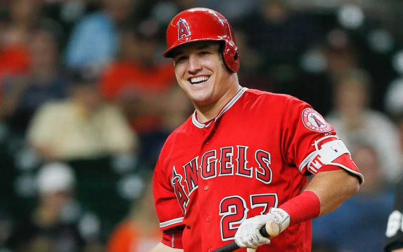 Baseball player Mike Trout smiling after hitting a foul ball during a game in Houston, Texas
