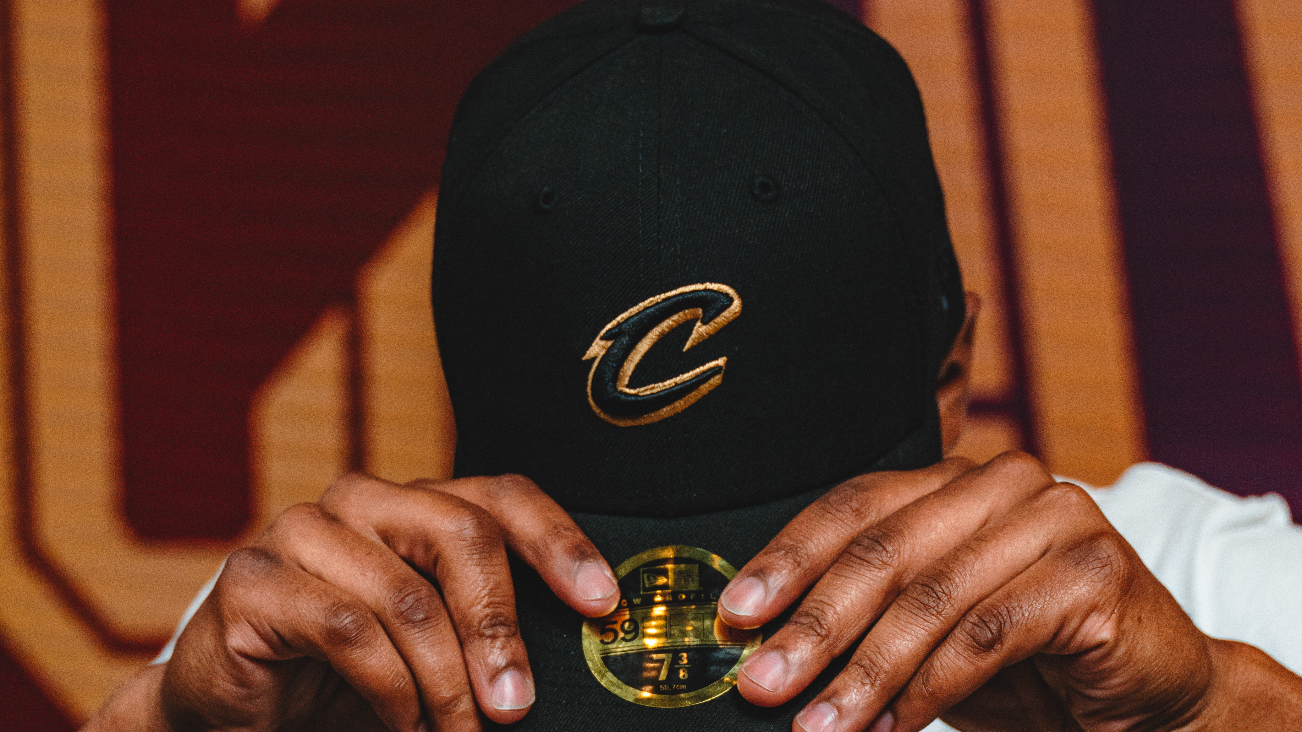 New Cavs logos emphasize gold and wine colors, drops navy