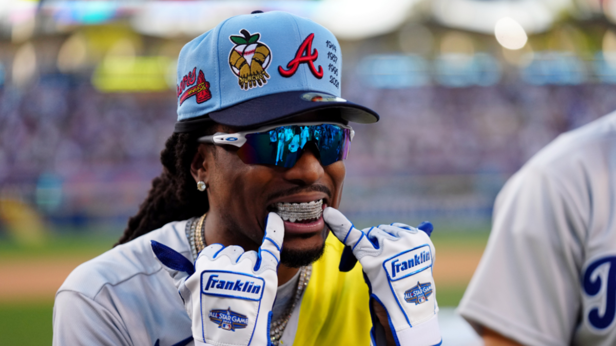 Quavo flashes his grill at the 2022 MLB All-Star Game